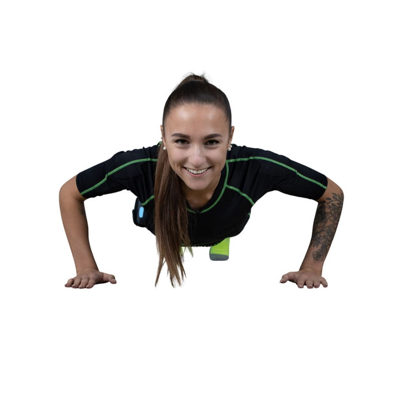 Smiling woman doing push-ups in a black and green EMS training suit on a white background.