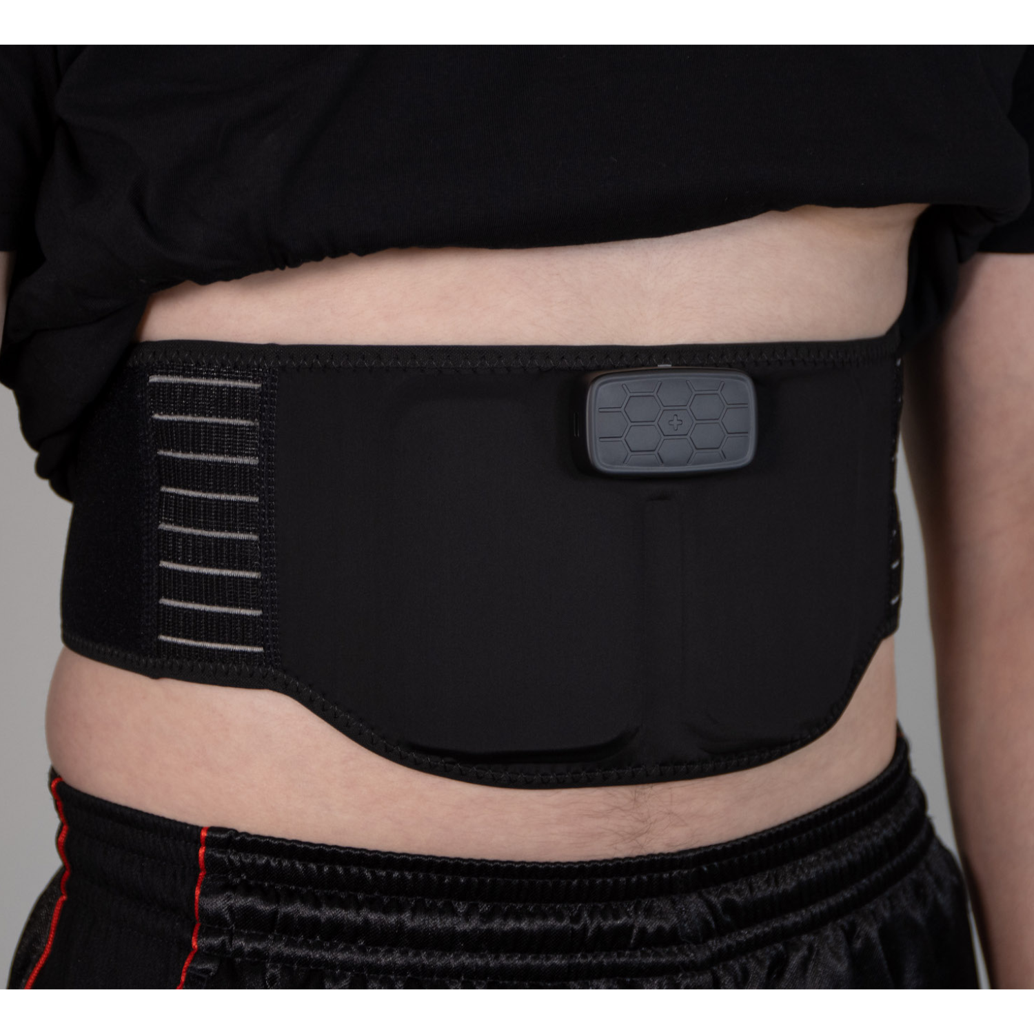 B-Ware EMS BELT for effective abdominal and lower back training, designed for discreet use under clothing.